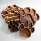 Wooden paw-shaped serving trays in various sizes, perfect for pet lovers or unique kitchen decor.
