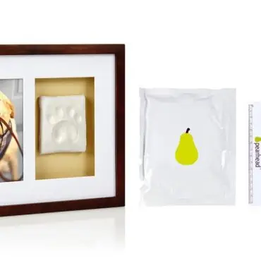 Dog pawprint kit with photo frame and accessories, perfect for pet memories and keepsakes.