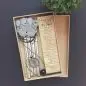 Memorial box with wind chimes and a sentimental poem titled Pawprints Left by You for pet remembrance.