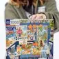 Person holding a 1000-piece puzzle box with vibrant kitchen illustration, eeBoo brand label visible.