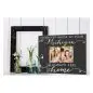 Picture frame with family photo and Michigan will always feel like home text on wooden background, next to vases.