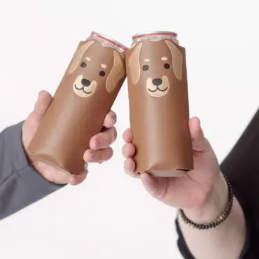 Two hands holding novelty dog-themed can koozies, perfect for keeping drinks cold and adding a cute touch.