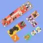 Dog-themed dominoes set with colorful tiles and playful illustrations on a blue background.