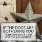 Humorous sign: If the dogs are bothering you, I can give you a treat and put you outside with rustic decor.