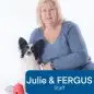 Blonde woman in a blue sweater poses with a black and white dog named Fergus, next to a red dog toy, on a white background.