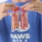 Person holding two bottles of pet-friendly Bubble Treats in Peanut Butter and Maple Bacon flavors.