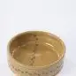 Handcrafted ceramic bowl with paw print design on light background. Ideal for pet lovers and home decor.