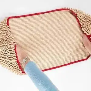 Microfiber chenille cleaning cloth with a red border, held by two hands, showcasing its absorbent texture.