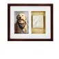 Framed photo of a happy dog with a leash and a paw print keepsake in a wooden frame.
