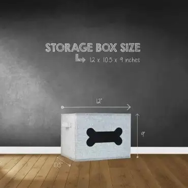 Gray dog toy storage box with bone design, 12x10.5x9 inches, against a blackboard wall with wooden floor.