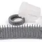 Pet paw cleaner with bristles and container. Ideal for removing dirt from dogs' paws. Easy to use and portable.
