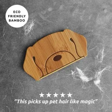 Eco-friendly bamboo pet hair remover with a five-star review, efficiently cleaning pet hair on fabric surfaces.