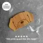 Eco-friendly bamboo pet hair remover with a five-star review, efficiently cleaning pet hair on fabric surfaces.