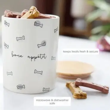 Dog treat jar with bone pattern, labeled Bone Appétit, keeping treats fresh. Microwave and dishwasher safe.