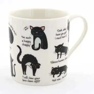 White mug with cute black cat illustrations and humorous captions, perfect for cat lovers.