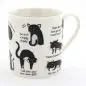 White mug with cute black cat illustrations and humorous captions, perfect for cat lovers.