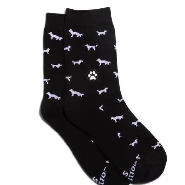 Black socks with white dog and paw print pattern, ideal for pet lovers.