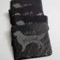 Set of black coasters engraved with Life is golden and a retriever silhouette, perfect for dog lovers.