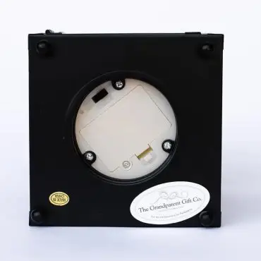 Back view of black electronic device with battery compartment, The Grandparent Gift Co. label, and Made in China sticker.