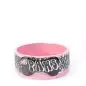 Pink ceramic pet bowl with PAWS design and paw prints, perfect for stylish feeding.