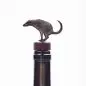 Unique animal-shaped wine bottle stopper, metal design atop a wine bottle.