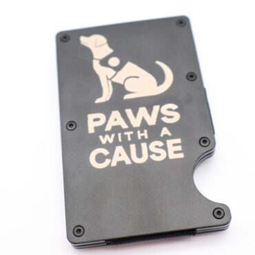 Black wallet with Paws with a Cause and dog graphic, promoting charity. White background.