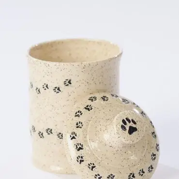 Speckled ceramic pet treat jar with paw print design, open lid showcasing cute and functional storage.