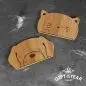 Cute cat and dog-shaped bamboo holders on grey fabric, finalist for 2023 Gift of the Year.