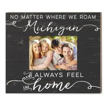 Decorative frame with family photo, text: Michigan will always feel like home. Black background, white script.