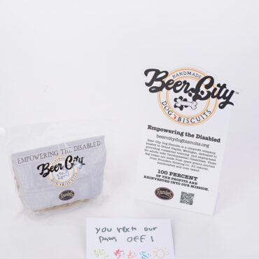 Beer City Dog Biscuits package and card promoting empowerment of the disabled, with a handwritten note saying You rock our paws off!
