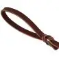 Close-up of a twisted brown leather loop on white background, showcasing texture and craftsmanship.