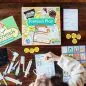 Child playing with veterinarian pretend playset, featuring pet care items and activity sheets on a wooden table.