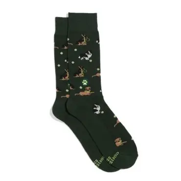 Green socks with playful dog pattern and paw prints, perfect for pet lovers. Cozy and stylish accessory.