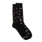 Black socks with colorful dog patterns and paw prints, perfect for pet lovers.