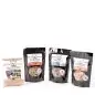 Packs of Beyond Bones all-natural dog treats, handcrafted by individuals with disabilities, displayed on a white background.