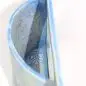 Blue decorative pouch with dog paw and bone pattern, open view showcasing interior design with light blue accents.