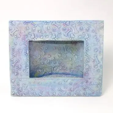 Blue pet-themed frame with paw prints and bone patterns, ideal for displaying cherished animal photos.