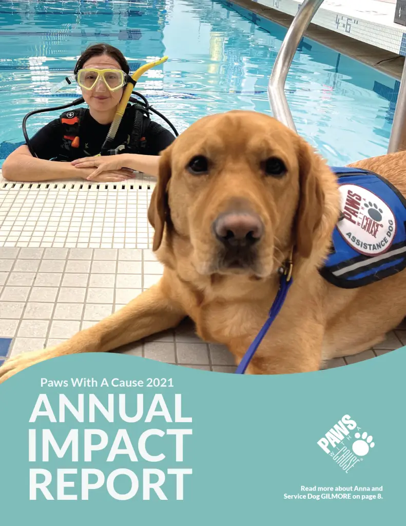 Diver with service dog at poolside for Paws With A Cause 2021 Annual Impact Report cover.