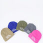 Five colorful beanies with Paws for Cause logos arranged on a white background.