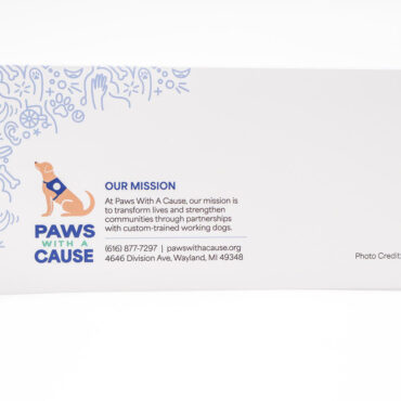 Paws With A Cause brochure featuring mission statement and contact information for custom-trained working dogs.