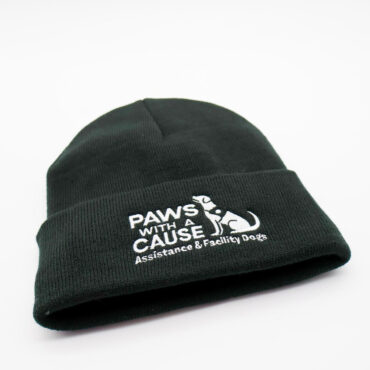 Black beanie with Paws With a Cause logo for assistance and facility dogs, white background.