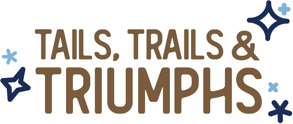 Tails, Trails & Triumphs logo with star and cross symbols in blue and brown text.