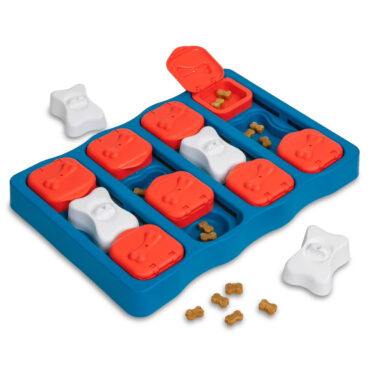 Dog treat puzzle toy with red and white covers revealing hidden compartments, enhancing pet enrichment and mental stimulation.