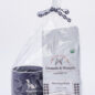 Gift set with Grounds & Hounds coffee and Paws with a Cause mug, wrapped in paw-print ribbon.