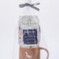 Gift set with Grounds & Hounds coffee and Paws with a Cause mug, wrapped in clear packaging with ribbon.