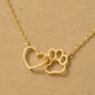 Gold necklace with heart and paw charm on brown background, symbolizing love for pets.