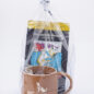 Gift set with Paws with a Cause mug and Grounds & Hounds coffee pack in plastic wrap. Perfect for dog lovers.