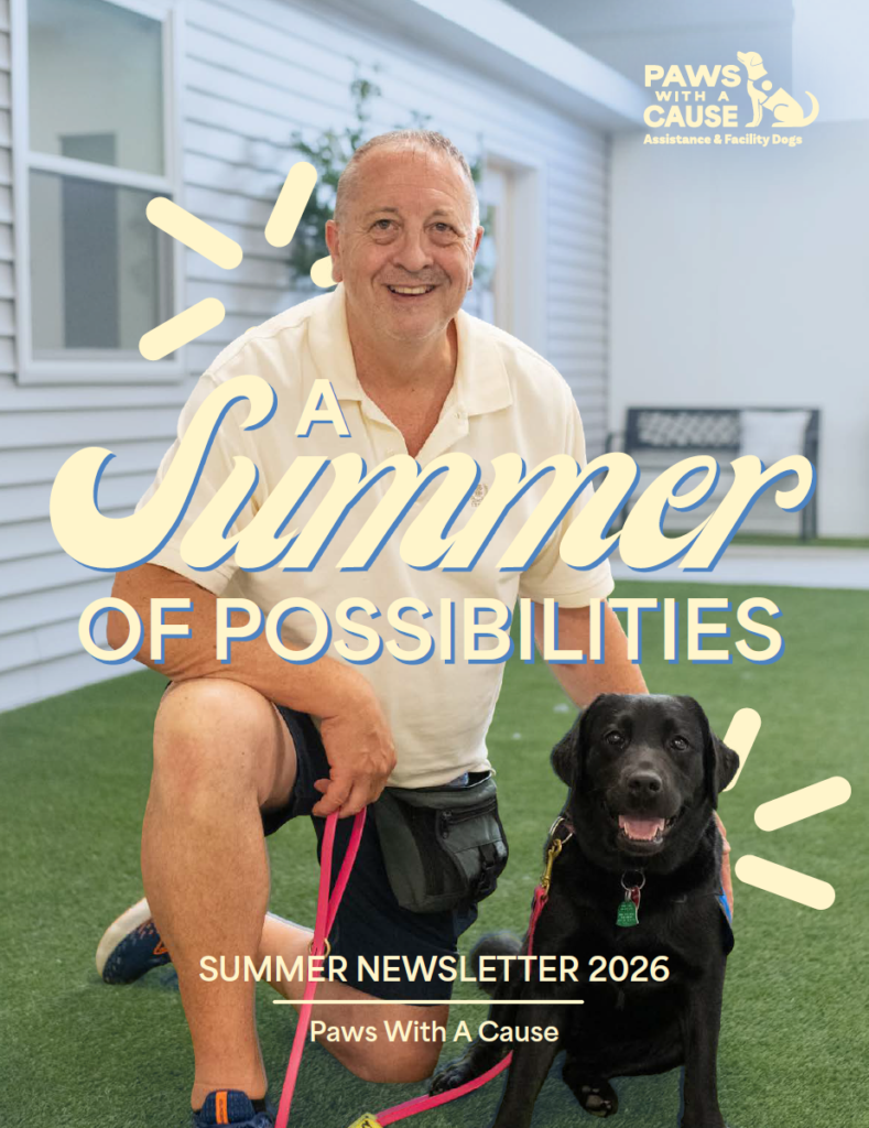 Man smiling with a black dog indoors, text reads A Summer of Possibilities, promoting Paws With A Cause newsletter.