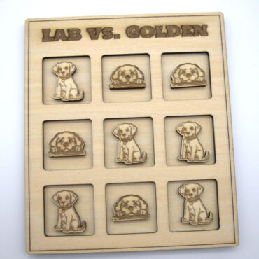 Wooden tic-tac-toe board featuring Labrador and Golden Retriever carvings. Fun canine-themed game setup.