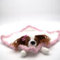 Crochet dog security blanket with a pink border, featuring a cute stuffed dog head and paws. Perfect for kids.